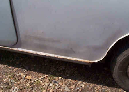 The quarter panel, and nearly an inch of filler covering very poor spot welds which have broken.